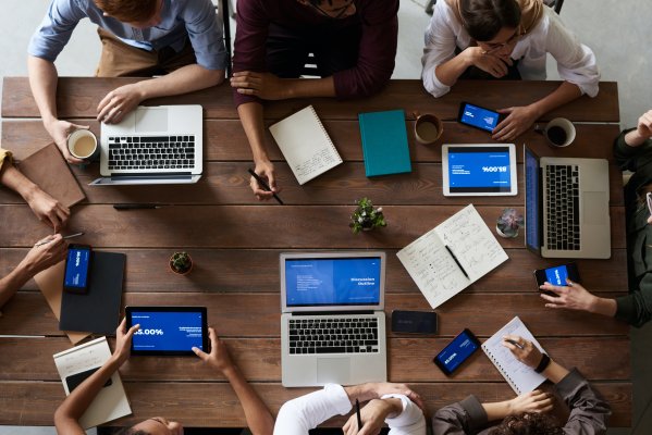 business meeting with laptops on a table